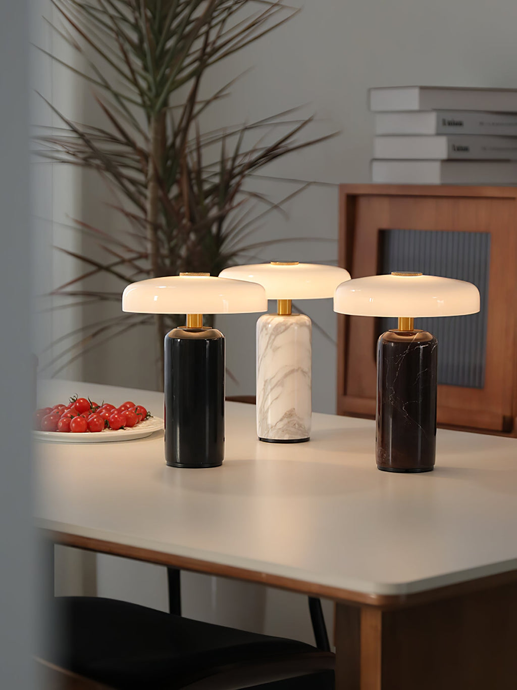Marble table lamp with round opaline shade, lit warm