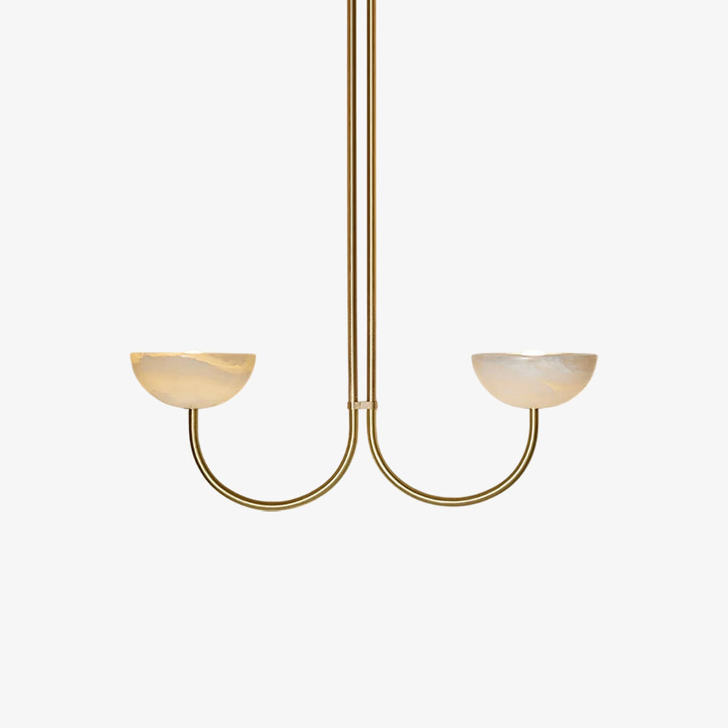 Clérachic brass two-arm Lunaris pendant with alabaster bowls softly lit, framed close against a pale grey backdrop.