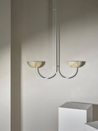 Clérachic white-finish Lunaris pendant with jade bowls in a room setting, arms curving out from a slim white stem.