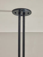 Detail of the Clérachic black ceiling canopy and its pair of support rods fixed at the mounting plate.