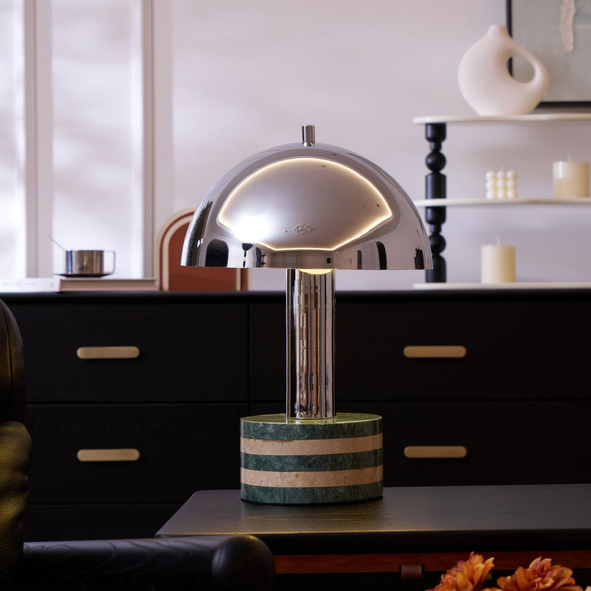 Wider view of the Clérachic lamp on the dresser, the full turned-wood candle shelf and small clock visible behind it.