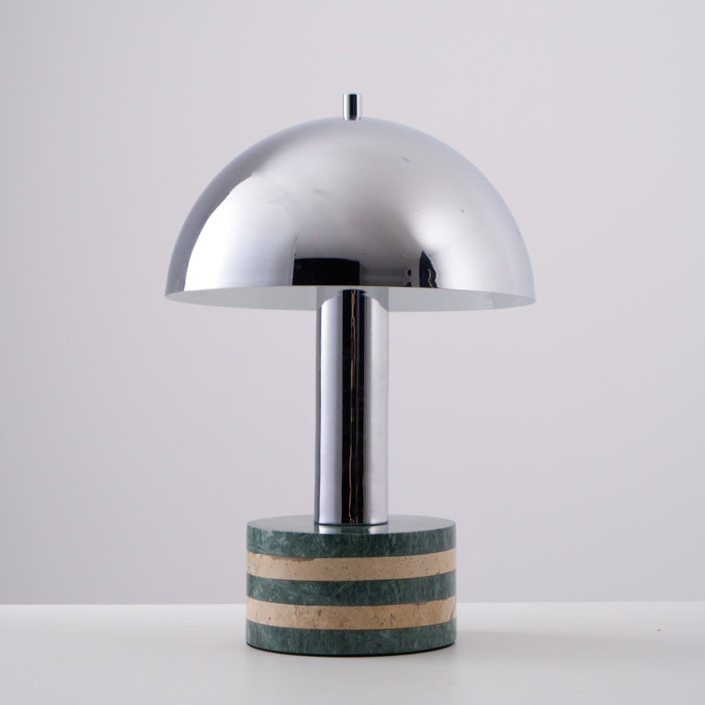 Plain studio shot of the Clérachic lamp straight-on and unlit, showing the full curve of its chrome dome.