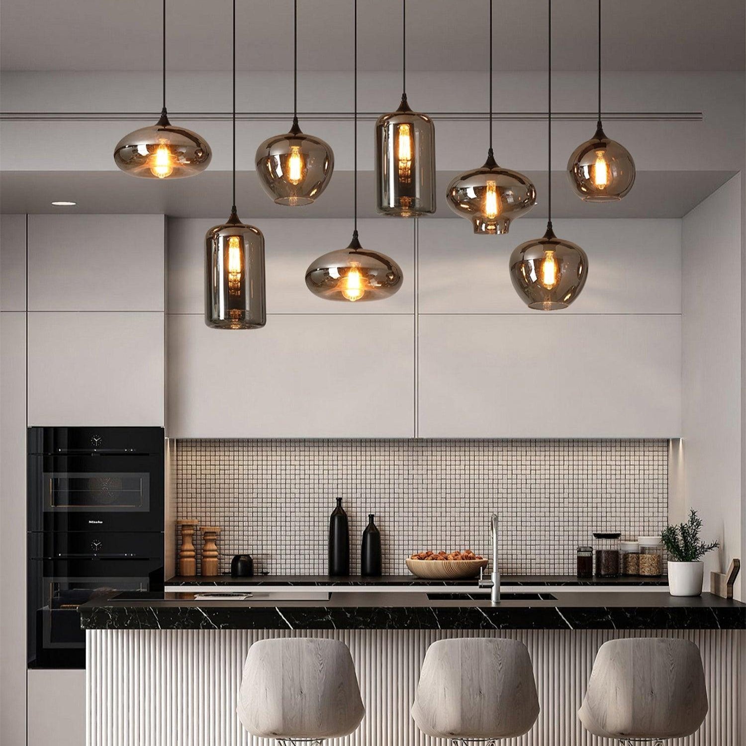 Hand-blown smoke gray glass pendant light with warm glow