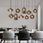 Smoke gray glass pendant light detail of black metal fitting