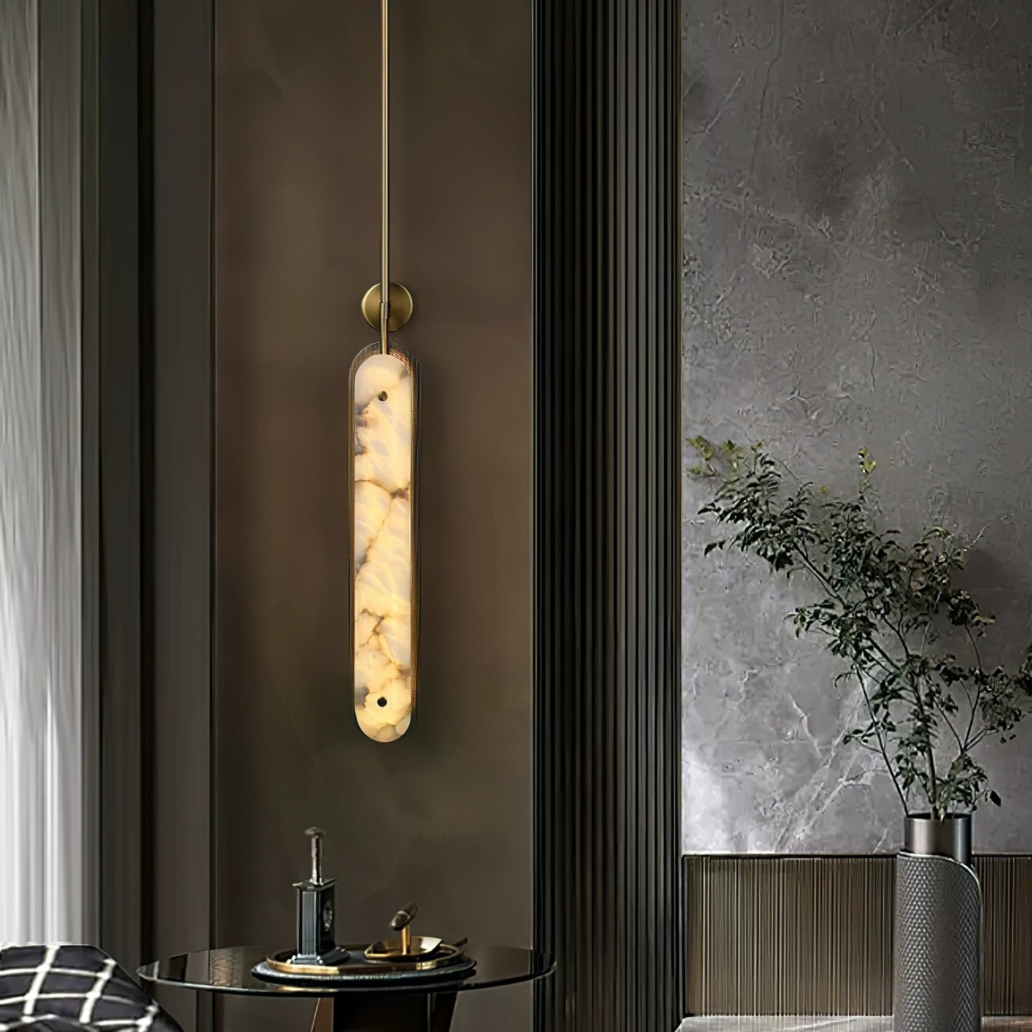 The light lit in a dark panelled corner beside a round table set with a small tray.