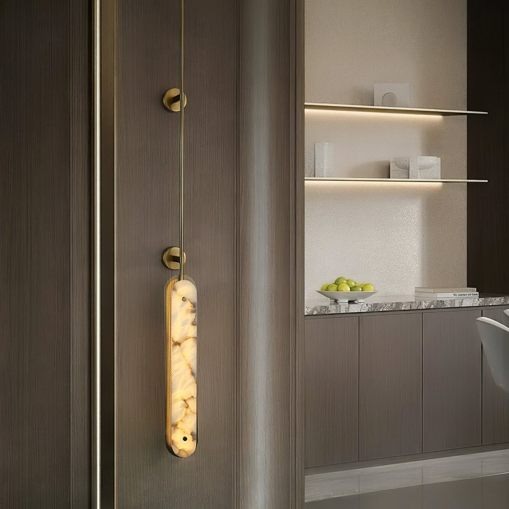 Lit on brushed timber panelling beside a kitchen counter with a bowl of green apples.