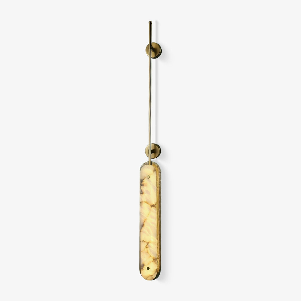 Studio view on white of the brass fixture, the alabaster panel lit from within.
