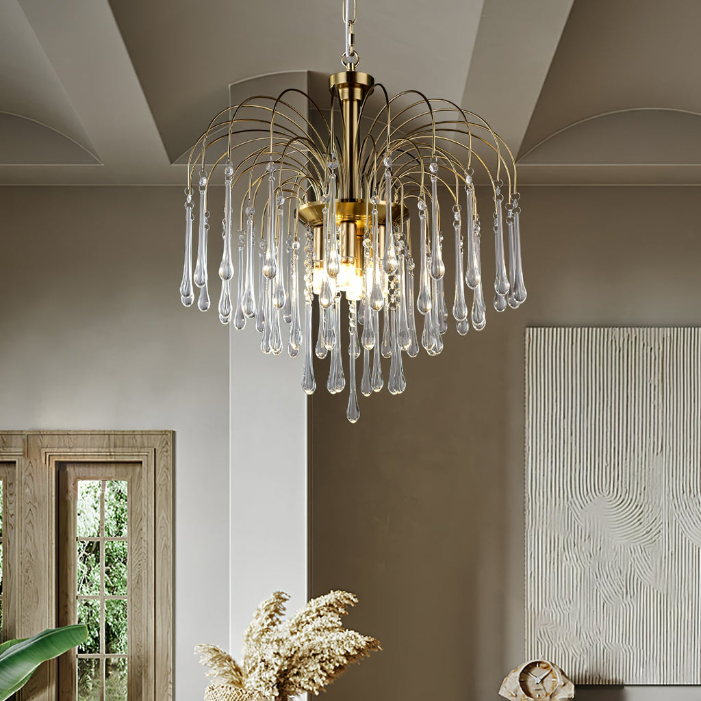This Clérachic pendant's clear crystal drops hang in a room with dried pampas grass and a leaning framed artwork.