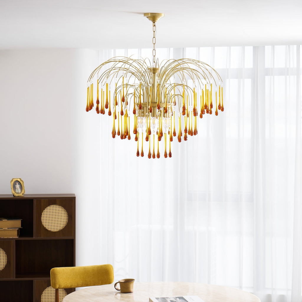 Sheer curtains glow brightly behind this Clérachic pendant, its caramel crystal drops catching light near a book-lined shelf.