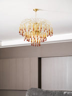 This Clérachic pendant hangs above a grey sofa and pale wood-panelled wardrobe with sliding doors.