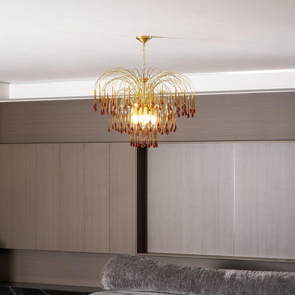 Caramel crystal drops glow on this Clérachic pendant, lit above a pale wood-panelled room and grey seating.