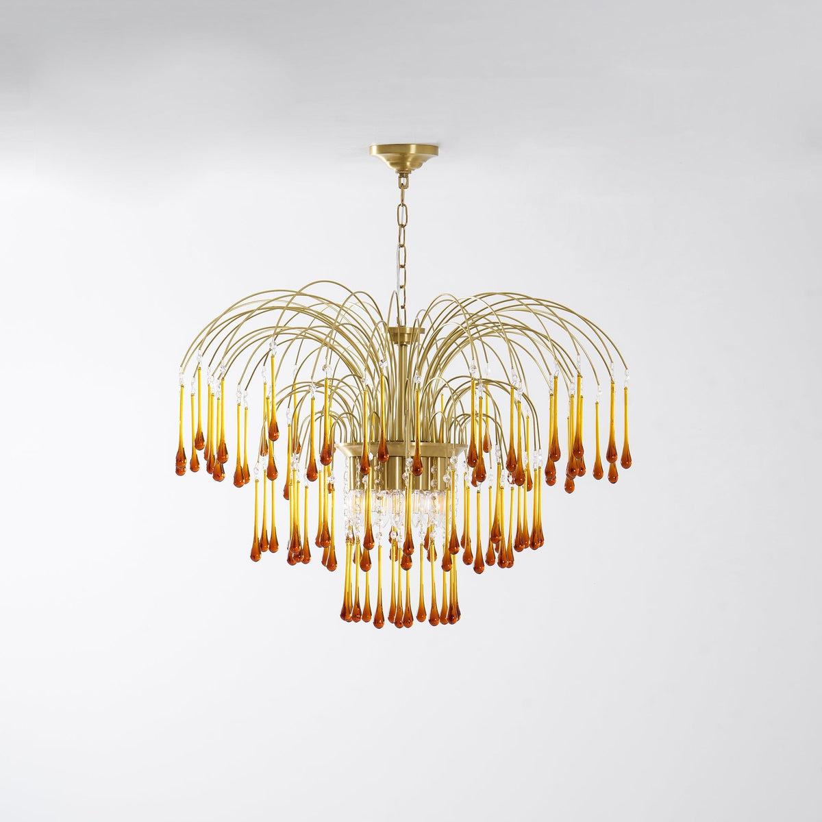 This Clérachic pendant's caramel crystal drops are lit and isolated on a plain white background.