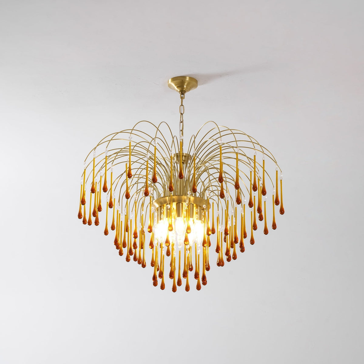 Set against plain white, this Clérachic pendant's caramel crystal drops catch a warm glow.