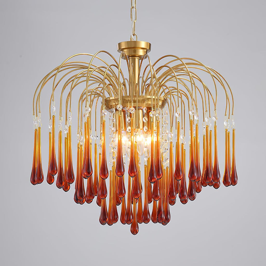 This Clérachic chandelier's caramel crystal tiers are lit against a plain grey studio backdrop.