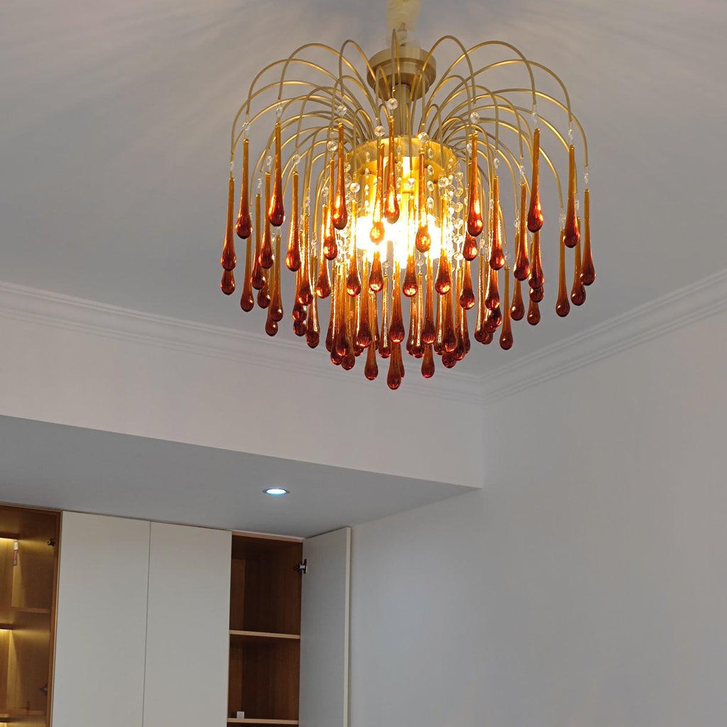 This Clérachic pendant's caramel crystal drops hang above dark wood cabinetry in a modern kitchen setting.