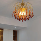 This Clérachic pendant's caramel crystal drops hang above dark wood cabinetry in a modern kitchen setting.