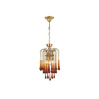 Clear crystal accents sit near the top of this Clérachic pendant's caramel crystal drops, isolated on white.
