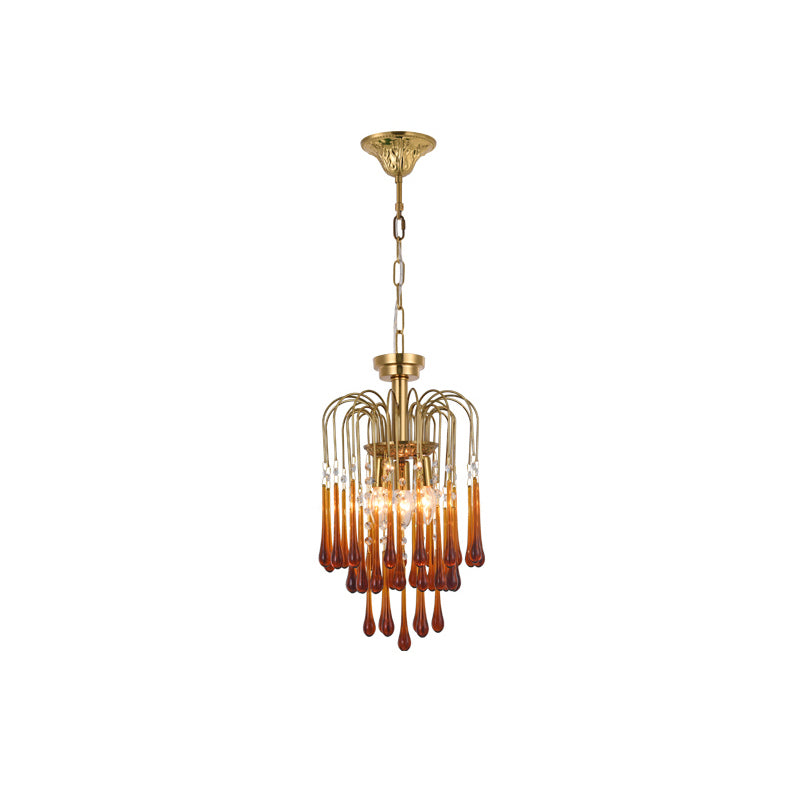 Clear crystal accents sit near the top of this Clérachic pendant's caramel crystal drops, isolated on white.