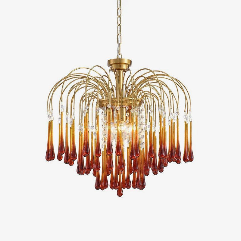 Product shot of this Clérachic chandelier isolated on white, caramel crystal drops cascading from curved gold-finish arms.