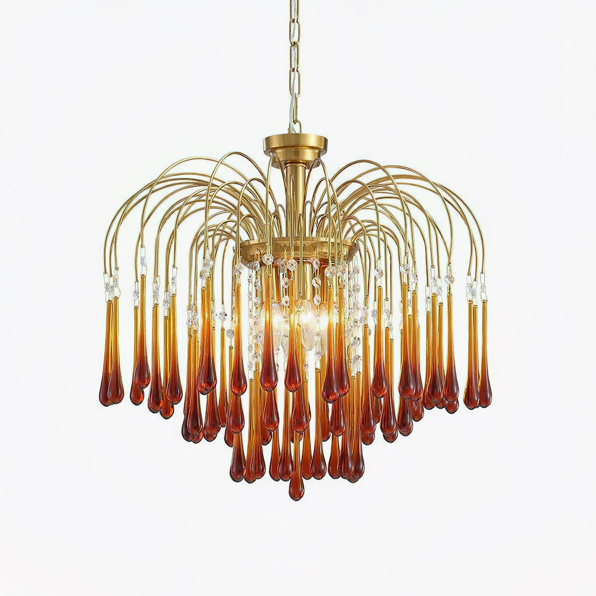 Caramel crystal drops fan out beneath brass arms on this Clérachic chandelier, shown isolated on a plain background.