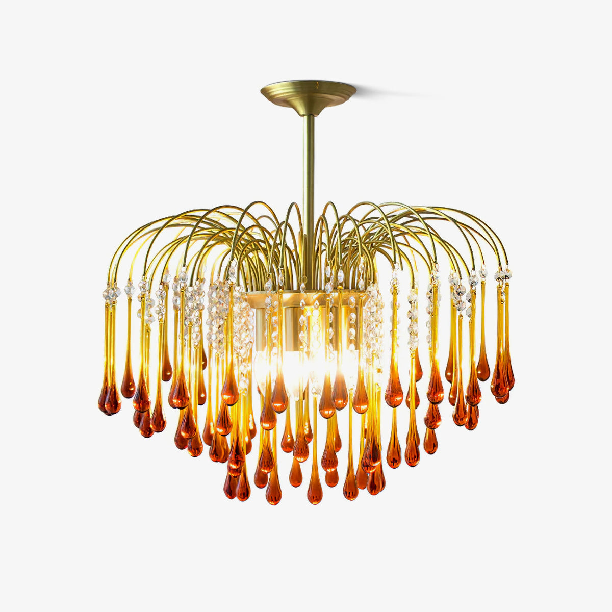 The flush-mount version of this Clérachic chandelier sits close to the ceiling, its caramel crystal drops catching the light.