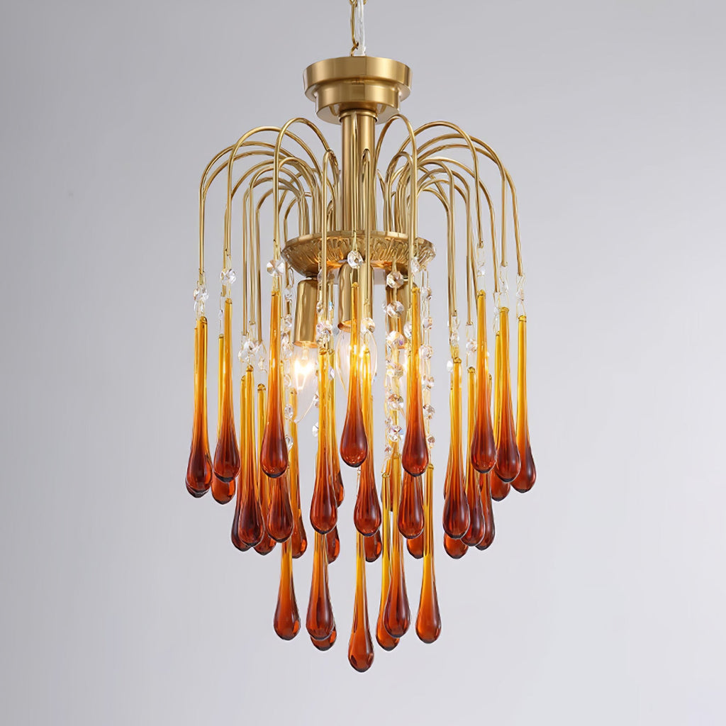 A fuller version of this Clérachic chandelier mixes caramel and clear crystal drops, lit brightly against dark grey.
