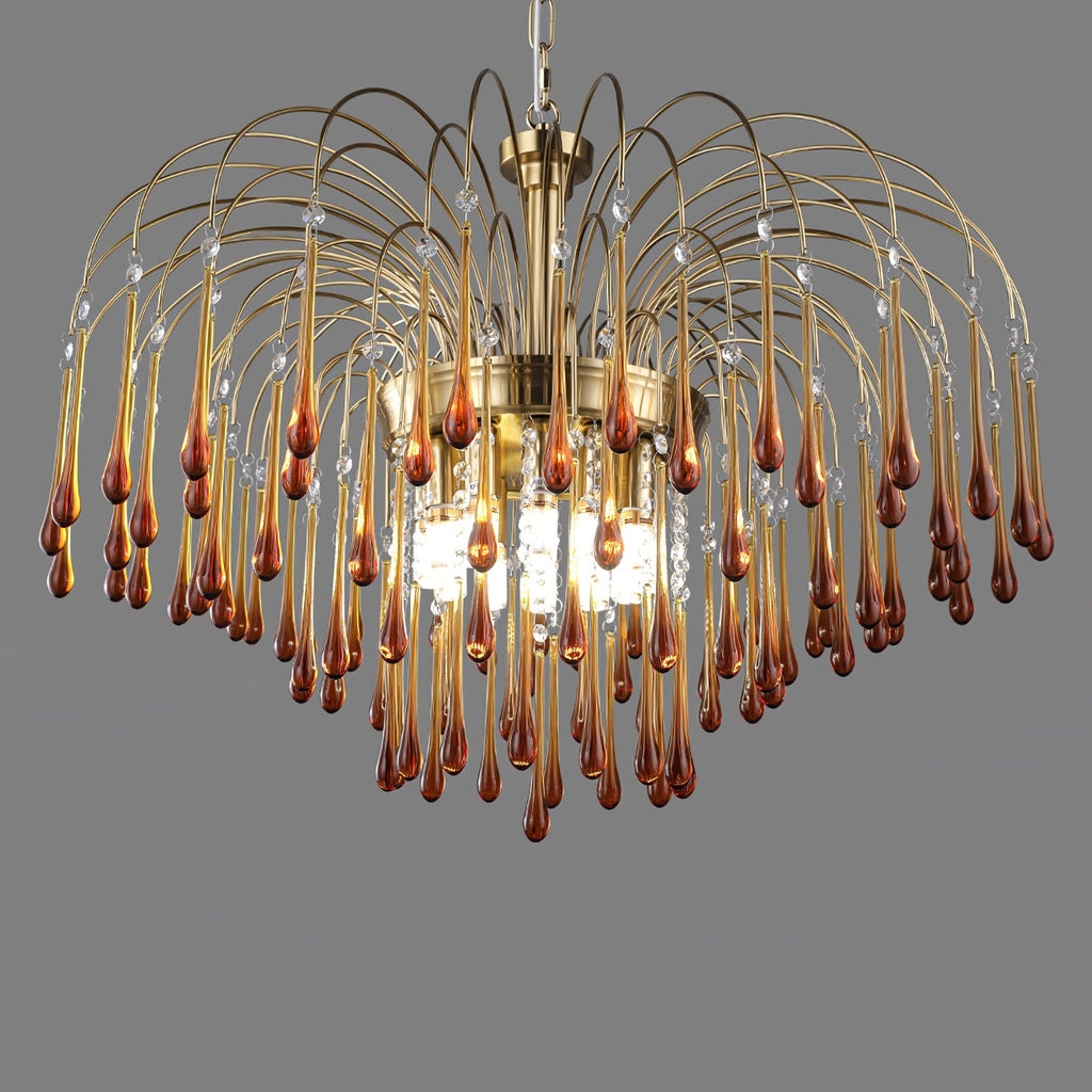This wide-tiered Clérachic chandelier's caramel crystal drops are lit from within against a dark grey background.