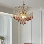 Crown moulding runs behind this Clérachic pendant, its caramel crystal drops darkening toward the tips near a sheer curtain.