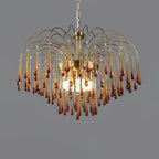 Deep red-brown crystal drops cluster closely on this Clérachic pendant, lit against a dark grey backdrop.