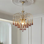An ornate ceiling rose sits above this Clérachic pendant, its caramel and clear crystal drops lit beside a sheer curtain.