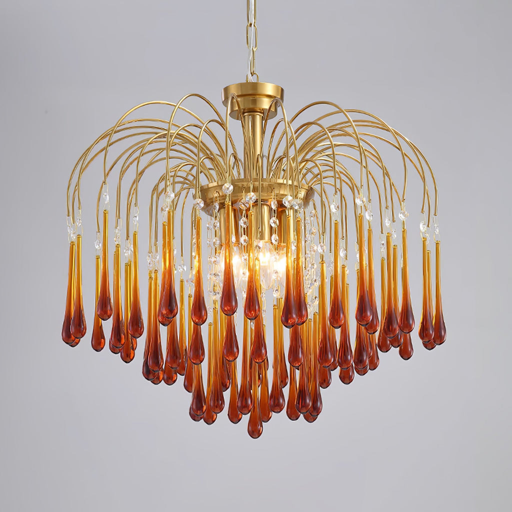 This large Clérachic chandelier's caramel crystal drops hang with clear accents, lit brightly on a plain background.
