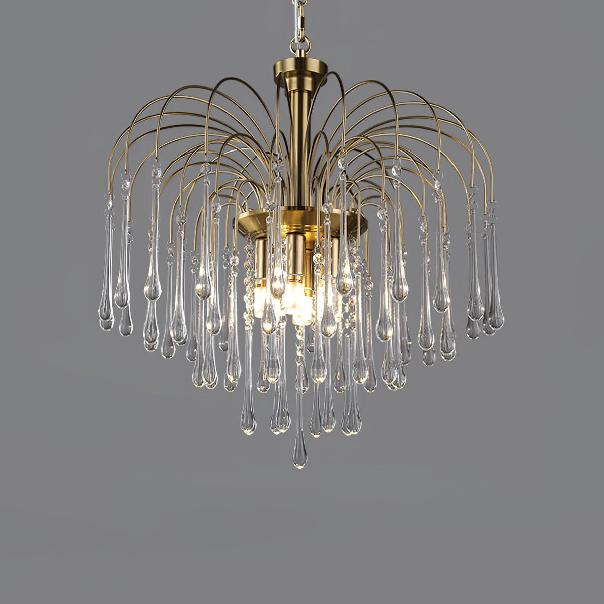 Clear crystal drops taper to fine points on this Clérachic pendant, lit against a dark grey backdrop.