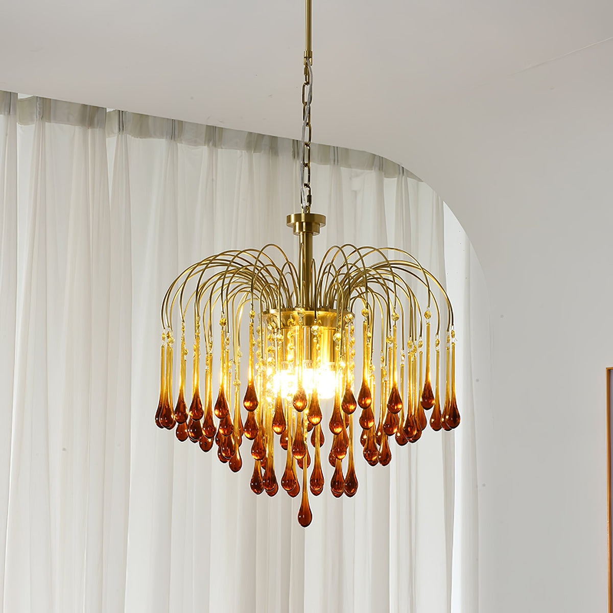 This Clérachic pendant's caramel crystal drops glow warm beside a sheer curtain in natural light.