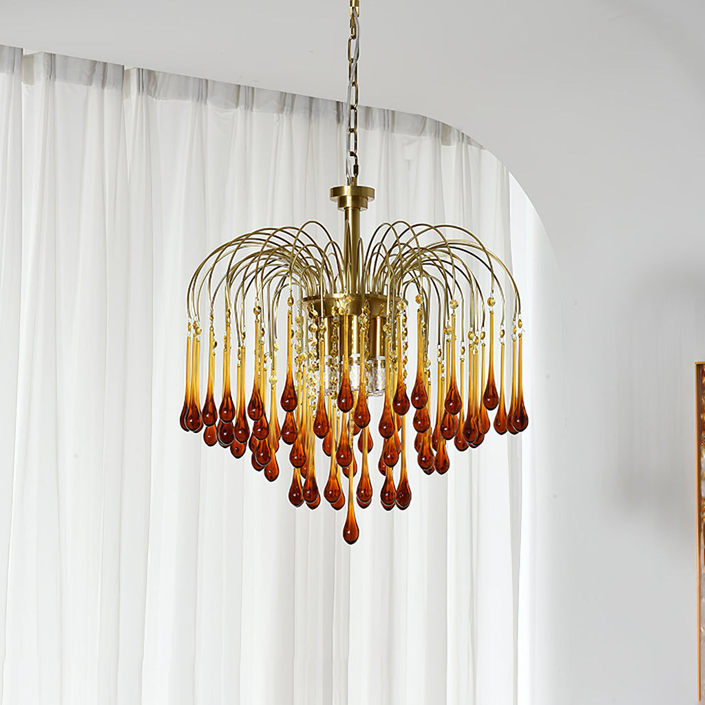 This Clérachic pendant's caramel crystal drops deepen from amber to red-brown, hung beside a sheer curtain.