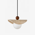 This Clérachic pendant balances a travertine sail on a walnut bead above a glowing opal glass globe.