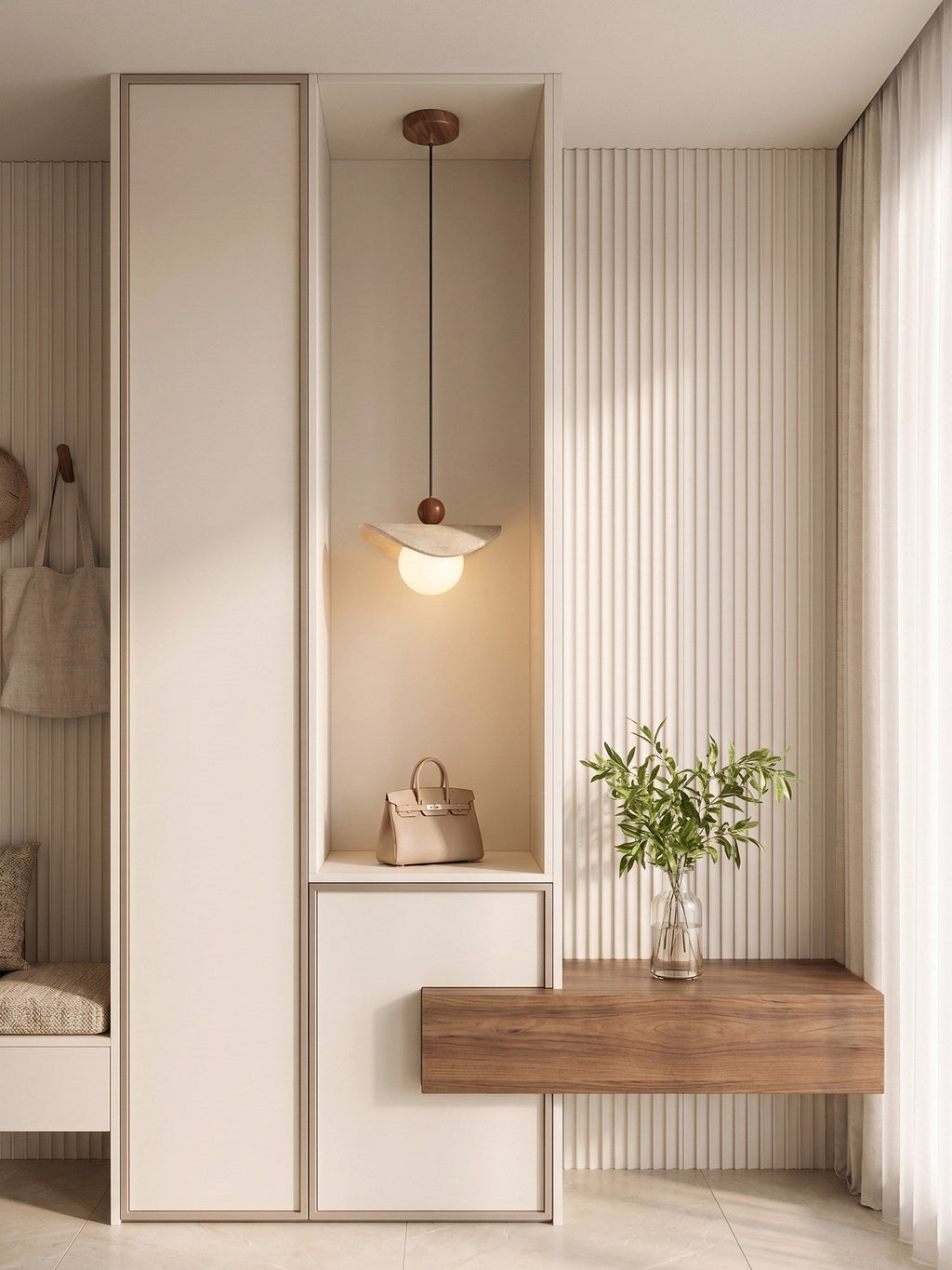 A travertine sail Clérachic pendant glows in a wardrobe nook styled with a leather bag and a small plant.