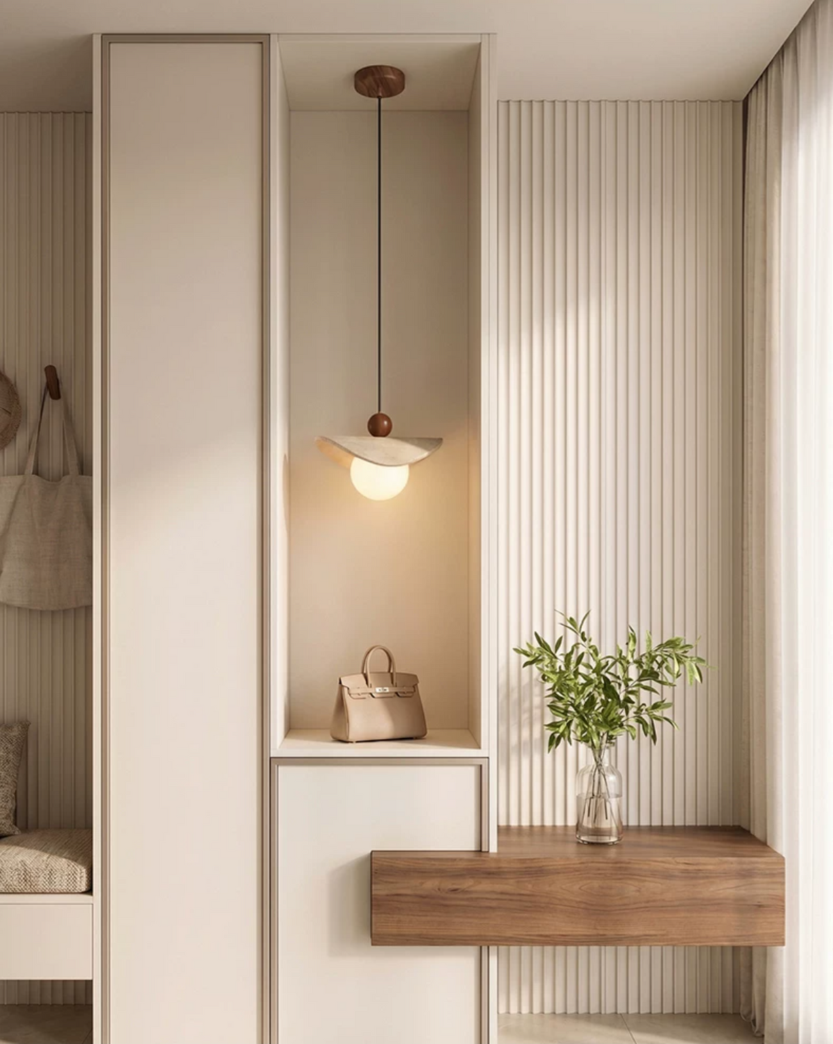 A travertine sail Clérachic pendant lights a wardrobe nook with an olive branch in a small vase.