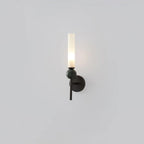 A green marble orb glows atop a Clérachic black-arm wall sconce, shown alone against a plain grey background.