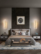 Alabaster wall light showing organic stone veining and brass trim