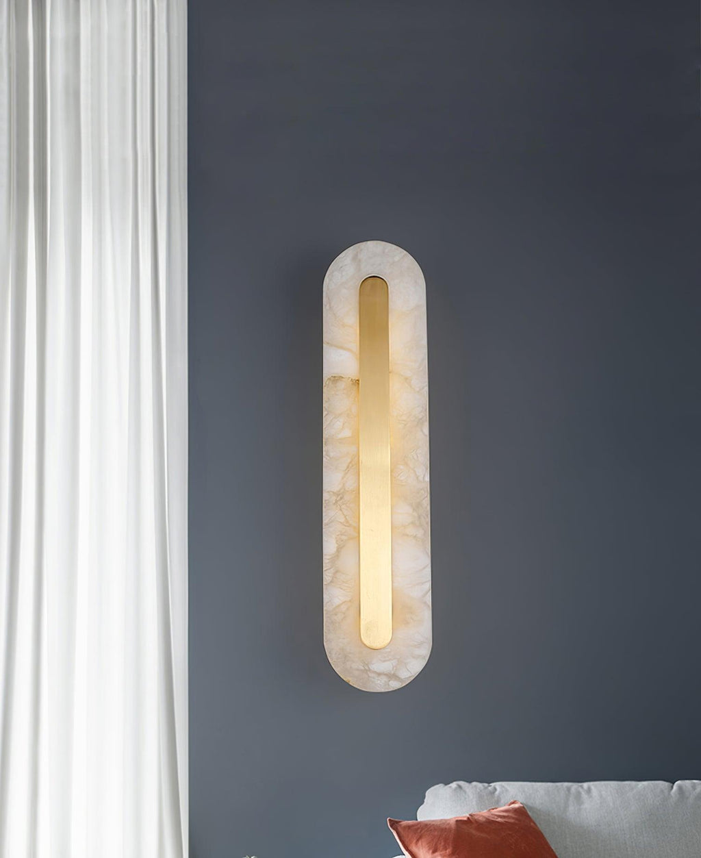 White alabaster sconce with brass fitting and soft integrated LED