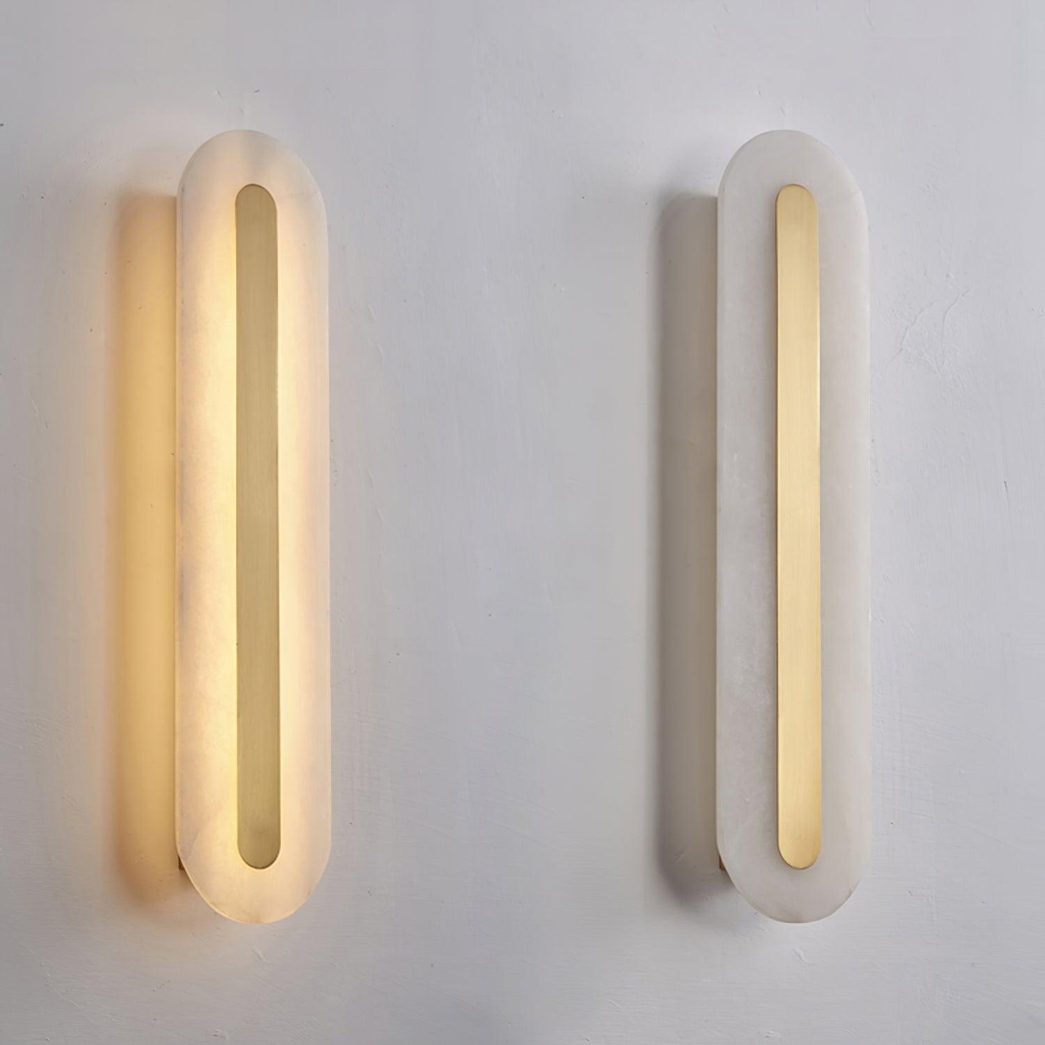 Two Clérachic Selvia wall lights side by side on a white plaster wall, one lit and one switched off