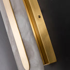 Detail of the Clérachic brass side channel and mounting screw along the edge of the Selvia wall light