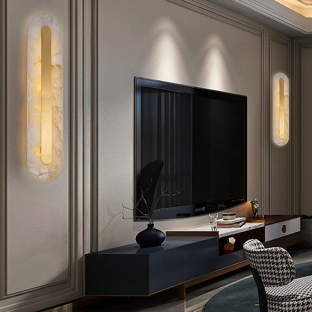 Two Clérachic Selvia wall lights lit either side of a wall-mounted television in a panelled living room