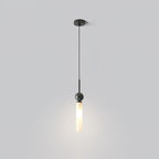 A studio shot of a single black marble Clérachic pendant light on a plain grey background, showing its straight ceiling stem.
