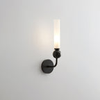 A closer angle brings this Clérachic black-arm wall sconce's black marble orb forward against a plain grey background.