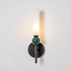 Lit at an angle against a white wall, the Clérachic wall light throws its shadow across the plaster behind it.