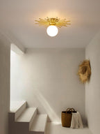 In a stairwell hung with woven wall art, this Clérachic ceiling light glows warm above a floor basket.