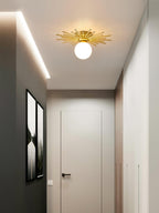 Mounted in a dark-walled hallway, this Clérachic ceiling light glows beside a framed print near the door.