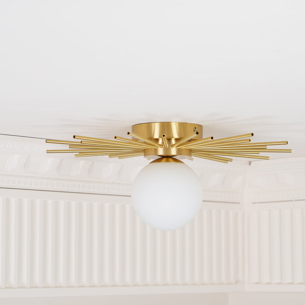 This Clérachic ceiling light is mounted in a corner beneath ornate white crown moulding.