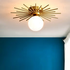 Against a deep teal accent wall, this Clérachic ceiling light glows warm from overhead.